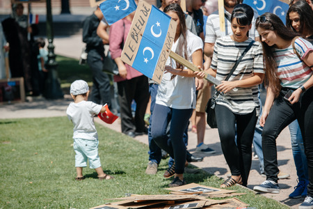 STRASBOURG, FRANCE - JULY 11, 2015: People preparing to protest -  Uyghur human rights activists participate in a demonstration to protest against Chinese government's policy in Uyghurのeditorial素材