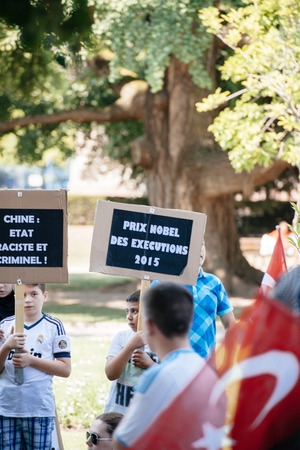 STRASBOURG, FRANCE - JULY 11, 2015: Nobel Prize for Execution to China in 2015 - Uyghur human rights activists participate in a demonstration to protest against Chinese government's policy in Uyghurのeditorial素材