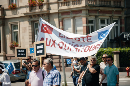 STRASBOURG, FRANCE - JULY 11, 2015: Uyghur human rights activists participate in a demonstration to protest against Chinese government's policy in Uyghurのeditorial素材