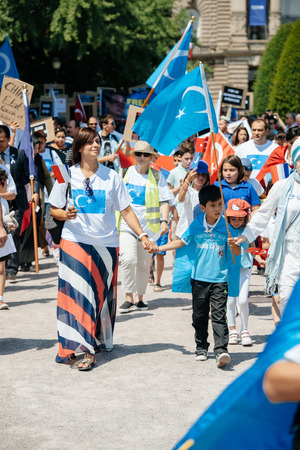 STRASBOURG, FRANCE - JULY 11, 2015: Uyghur human rights activists participate in a demonstration to protest against Chinese government's policy in Uyghurのeditorial素材