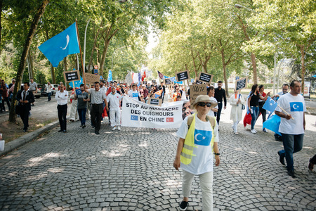 STRASBOURG, FRANCE - JULY 11, 2015: Uyghur human rights activists participate in a demonstration to protest against Chinese government's policy in Uyghurのeditorial素材