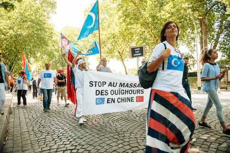 STRASBOURG, FRANCE - JULY 11, 2015: Uyghur human rights activists participate in a demonstration to protest against Chinese government's policy in Uyghurのeditorial素材