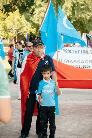 STRASBOURG, FRANCE - JULY 11, 2015: Uyghur human rights activists participate in a demonstration to protest against Chinese government's policy in Uyghurのeditorial素材