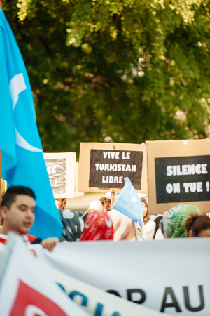 STRASBOURG, FRANCE - JULY 11, 2015: Vive le Turkistan libre placard - Uyghur human rights activists participate in a demonstration to protest against Chinese government's policy in Uyghurのeditorial素材