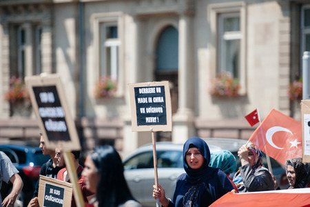 STRASBOURG, FRANCE - JULY 11, 2015: Uyghur human rights activists participate in a demonstration to protest against Chinese government's policy in Uyghurのeditorial素材