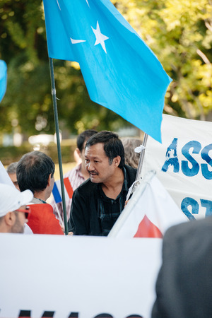 STRASBOURG, FRANCE - JULY 11, 2015: Uyghur human rights activists participate in a demonstration to protest against Chinese government's policy in Uyghurのeditorial素材