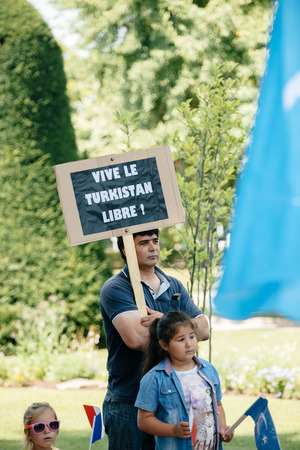 STRASBOURG, FRANCE - JULY 11, 2015: Vive le Turkistan libre placard - Uyghur human rights activists participate in a demonstration to protest against Chinese government's policy in Uyghurのeditorial素材