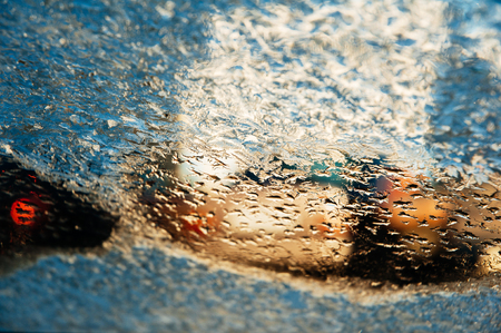 Melting frozen windshield on a cold winter dayの写真素材