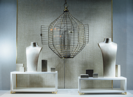 Empty jewelry store show-window with a two dummy torso, an empty cage and no gems or goldの写真素材