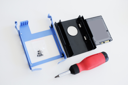 SSD disk mounting kit (solid state drive) instalation kit including screwdriver for a faster computer as seen from aboveの写真素材