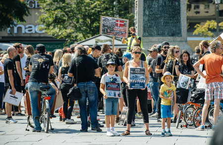 STRASBOURG, FRANCE - AUG 22, 2015: Marine conservation non-profit organization Sea Shepherd protesting against the slaughter of pilot whales and arrest of 7 crew members - family protesting with placardのeditorial素材