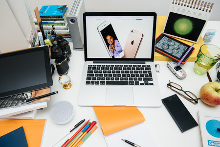 PARIS, FRANCE - SEP 9, 2015: Apple Computers website on MacBook Pro Retina in a creative room environment showcasing the newly announced iPhone 6s and iPhone 6S plusのeditorial素材