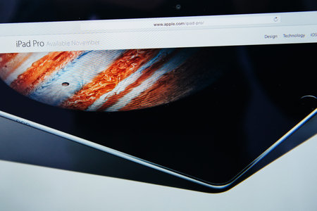 PARIS, FRANCE - SEP 9, 2015: Apple Computers website on MacBook Pro Retina in a creative room environment showcasing the newly announced iPad Pro availability date in Novemberのeditorial素材