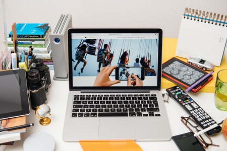 PARIS, FRANCE - SEP 10, 2015: Apple Computers website on MacBook Pro Retina in a creative room environment showcasing the newly announced Apple TVのeditorial素材