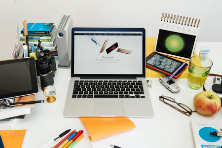 PARIS, FRANCE - SEP 9, 2015: Apple Computers website on MacBook Pro Retina in a creative room environment showcasing the newly announced iPhone 6s and iPhone 6s Plusのeditorial素材