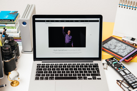 PARIS, FRANCE - SEP 10, 2015: Apple Computers website on MacBook Pro Retina in a creative room environment with Tim Cook, Apple CEO waving hands before Apple eventのeditorial素材