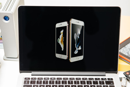 PARIS, FRANCE - SEP 10, 2015: Apple Computers website on MacBook Pro Retina in a creative room environment showcasing the newly announced iPhone 6s and iPhone 6s Plusのeditorial素材