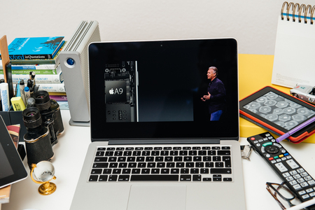 PARIS, FRANCE - SEP 10, 2015: Apple Computers website on MacBook Pro Retina in a creative room environment showcasing the newly announced A9 chip in Apple iphone 6sのeditorial素材