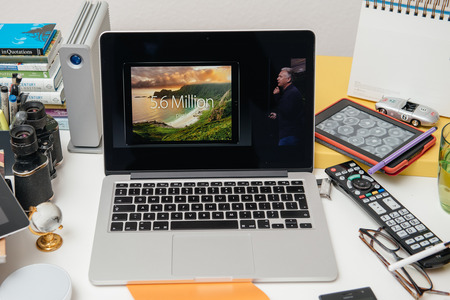 PARIS, FRANCE - SEP 10, 2015: Apple Computers website on MacBook Pro Retina in a creative room environment showcasing Philip Schiller from Apple talking about resolution of iPad Proのeditorial素材
