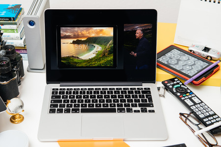 PARIS, FRANCE - SEP 10, 2015: Apple Computers website on MacBook Pro Retina in a creative room environment showcasing Philip Schiller from Apple talking about resolution of iPad Proのeditorial素材