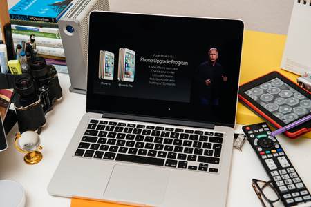 PARIS, FRANCE - SEP 10, 2015: Apple Computers website on MacBook Pro Retina in a creative room environment showcasing the newly announced iPhone Upgrade Programのeditorial素材