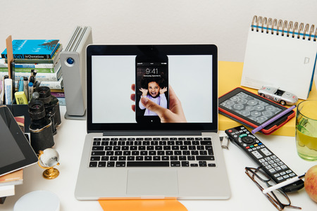 PARIS, FRANCE - SEP 10, 2015: Apple Computers website on MacBook Pro Retina in a creative room environment showcasing the newly announced iPhone 6S with living photosのeditorial素材