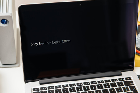 PARIS, FRANCE - SEP 10, 2015: Apple Computers website on MacBook Pro Retina in a creative room environment showcasing  Jony Ive, Chief Design Officer berofe Apple Eventのeditorial素材