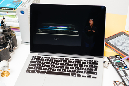 PARIS, FRANCE - SEP 10, 2015: Apple Computers website on MacBook Pro Retina in a creative room environment showcasing Philip Schiller from Apple talking about display of iPad Proのeditorial素材