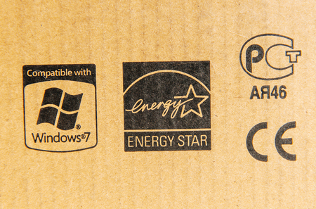 LONDON, UNITED KINGDOM - MARCH 8, 2014: Compatible with Windows 7, Energy Star, CE Mark and Russian Standard signs on a computer cardboard boxのeditorial素材