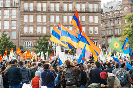STRASBOURG, FRANCE - OCT 4, 2015 Demonstrators protesting against Turkish President Recep Tayyip Erdogan's visit to Strasbourg - crowd waving armenian flagのeditorial素材