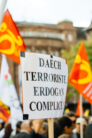 STRASBOURG, FRANCE - OCT 4, 2015 Demonstrators protesting against Turkish President Recep Tayyip Erdogan's visit to Strasbourg - daesh terrorists and Erdogan is accomplice placardのeditorial素材