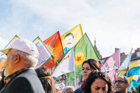 STRASBOURG, FRANCE - OCT 4, 2015 Demonstrators protesting against Turkish President Recep Tayyip Erdogan's visit to Strasbourg - Abdullah Ocalan supprters waving flagsのeditorial素材