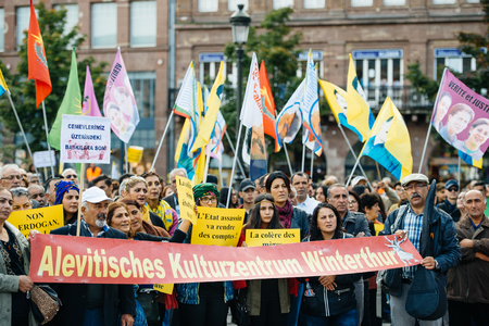 STRASBOURG, FRANCE - OCT 4, 2015 Demonstrators protesting against Turkish President Recep Tayyip Erdogan's visit to Strasbourg - Alevites holding anti-Erdogan Placardsのeditorial素材