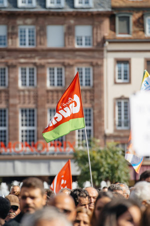 STRASBOURG, FRANCE - OCT 4, 2015 Demonstrators protesting against Turkish President Recep Tayyip Erdogan's visit to Strasbourg - left wing flag at protestのeditorial素材