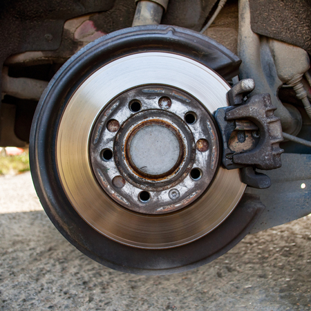 Disc brake detailed closeup during annual inspectionの写真素材
