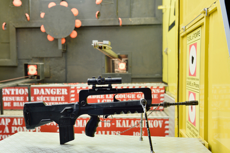 STRASBOURG, FRANCE - JULY 19, 2015: Gun rifle waiting for customers for playing shooting games at amusement parkのeditorial素材