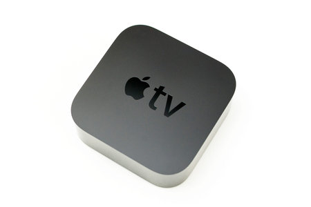 PARIS, FRANCE - NOV 10, 2015: New Apple TV media streaming  player microconsole by Apple Computers -...