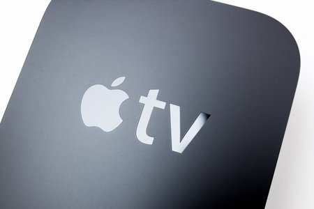PARIS, FRANCE - NOV 10, 2015: Apple logo on the new Apple TV media streaming  player microconsole by...