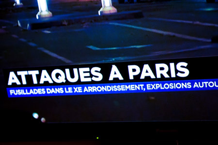 PARIS, FRANCE - NOV 13, 2013: French Television reporting live as rescuers working on the schene of the attack. At least 40 people were killed across Paris, with explosions outside the national stadium where France was hosting German teamのeditorial素材