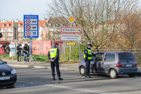 STRASBOURG, FRANCE - NOV 14 2015: French Police checking vehicles on the 'Bridge of Europe' between Strasbourg and Kehl Germany, as a security measure in the wake of attacks in Paris - security passport checkのeditorial素材