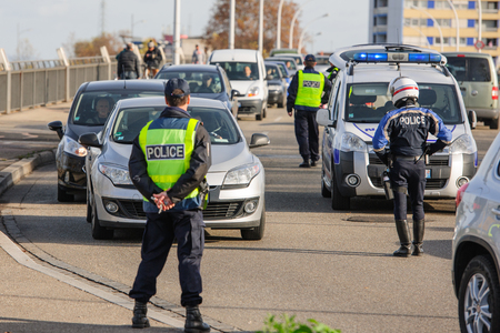 STRASBOURG, FRANCE - NOV 14 2015: French Police checking vehicles on the 'Bridge of Europe' between Strasbourg and Kehl Germany, as a security measure in the wake of attacks in Paris - police inspecting every carのeditorial素材