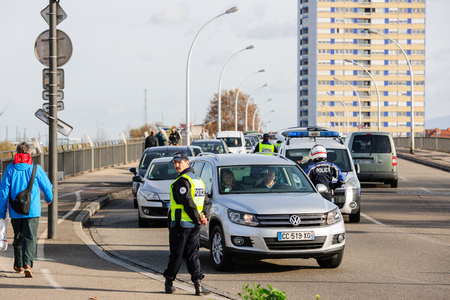 STRASBOURG, FRANCE - NOV 14 2015: French Police checking vehicles on the 'Bridge of Europe' between Strasbourg and Kehl Germany, as a security measure in the wake of attacks in Parisのeditorial素材
