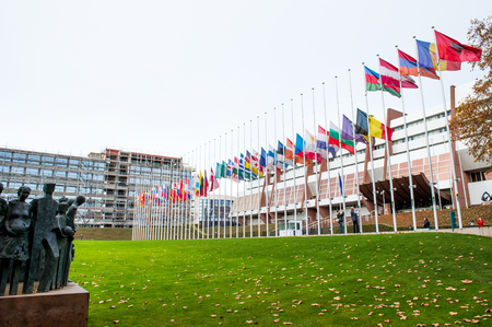 STRASBOURG, FRANCE - 14 Nov 2015: All European Union Flag flies at half-mast in front of the Council of Europe following an terrorist attack in Parisのeditorial素材