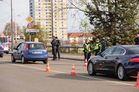 STRASBOURG, FRANCE - NOV 14 2015: French Police with machine gun checking vehicles on the 'Bridge of Europe' between Strasbourg and Kehl Germany, as a security measure in the wake of attacks in Parisのeditorial素材