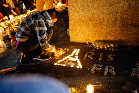 STRASBOURG, FRANCE - NOV 18, 2015: Man making Eiffel Tower from candles in center of Strasbourg, in...