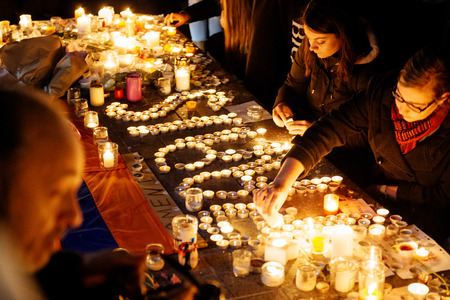 STRASBOURG, FRANCE - NOV 18, 2015: People writing Paris word with candles  in center of Strasbourg, in solidarity for victims and families of the assault in Parisのeditorial素材