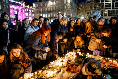 STRASBOURG, FRANCE - NOV 18, 2015: People gathering, placing flowers, messages and candles in center of Strasbourg, in solidarity for victims and families of the assault in Parisのeditorial素材