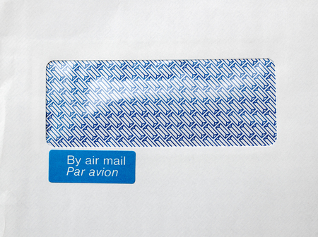 FRANKFURT, GERMANY - JANUARY 14, 2016: Envelope with window and By air mail, par avion blue stickerのeditorial素材