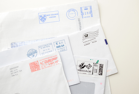 FRANKFURT, GERMANY - JANUARY 14, 2015: Postage envelopes elements - set of various detailed post stamps and postage letters from US, France and Germany, United Kingdomのeditorial素材
