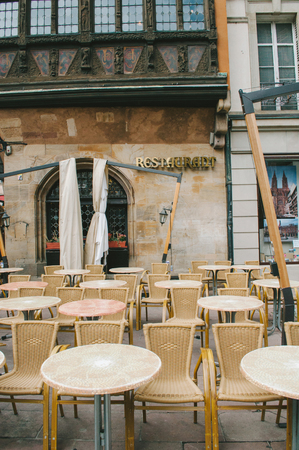 STRASBOURG, FRANCE - SEP 14, 2009: Film look of tables and seats in front of the Maison Kammerzell restaurant - one of the oldest building in Strasbourg, built around 1427のeditorial素材